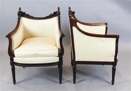 A pair of Louis XVI style carved rosewood armchairs, W.2ft 2in. D.1ft 11in. H.2ft 11in.